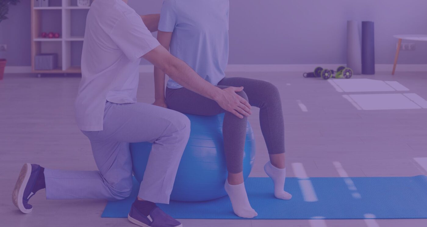 physiotherapist showing patient exercise for rehab